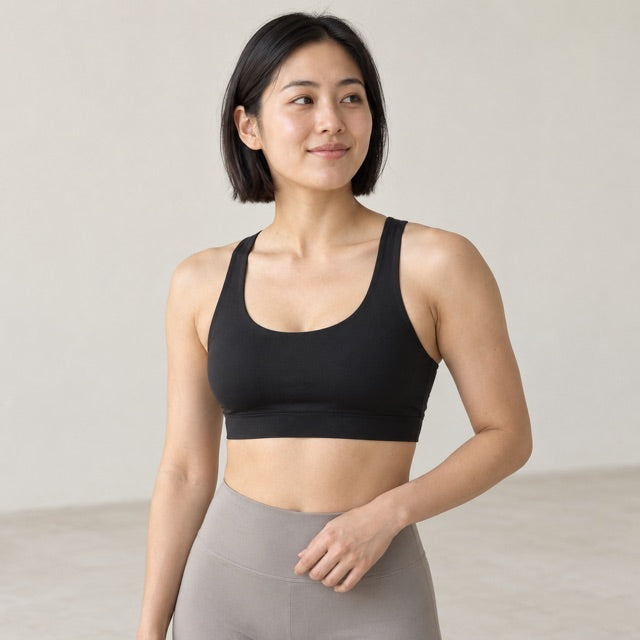 Model wearing a black sports bra